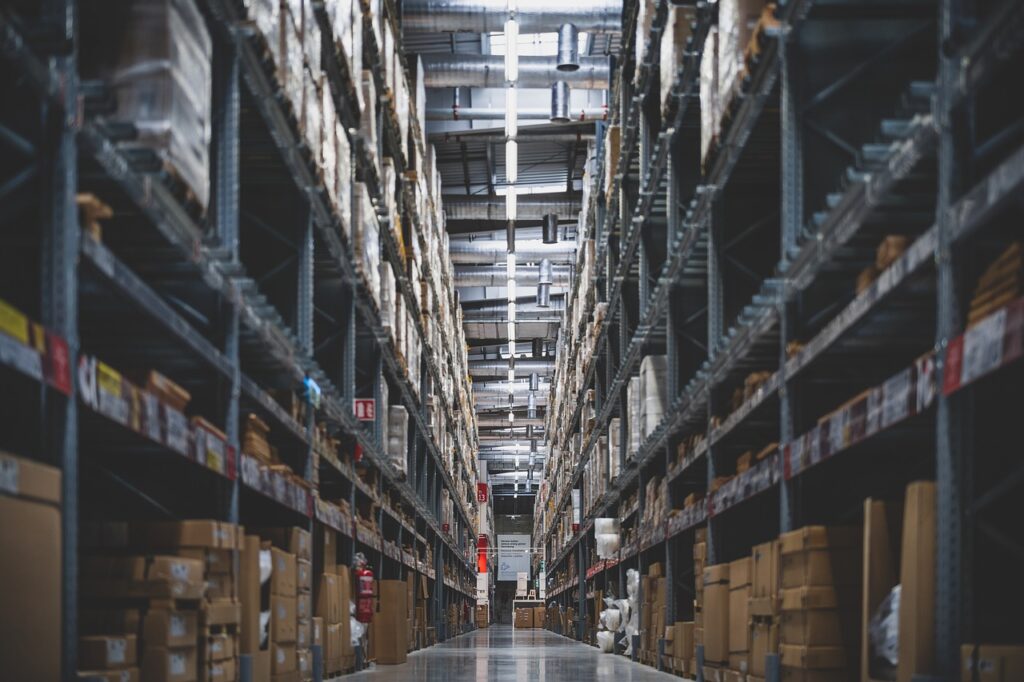 Inside of a large warehouse with boxes stacked on the selves